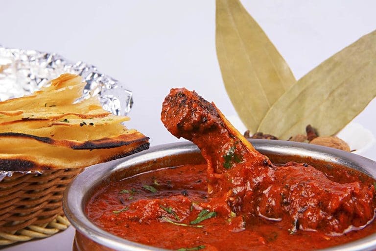 Kadhai chicken or Spicy Reddish Chicken Masala  Curry served with Lachcha Paratha